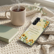 Rejoice in Hope Romans 12:12 Christian Samsung Galaxy phone case with sunflower art on a cozy knit blanket next to a steaming cup of coffee and a devotional book.