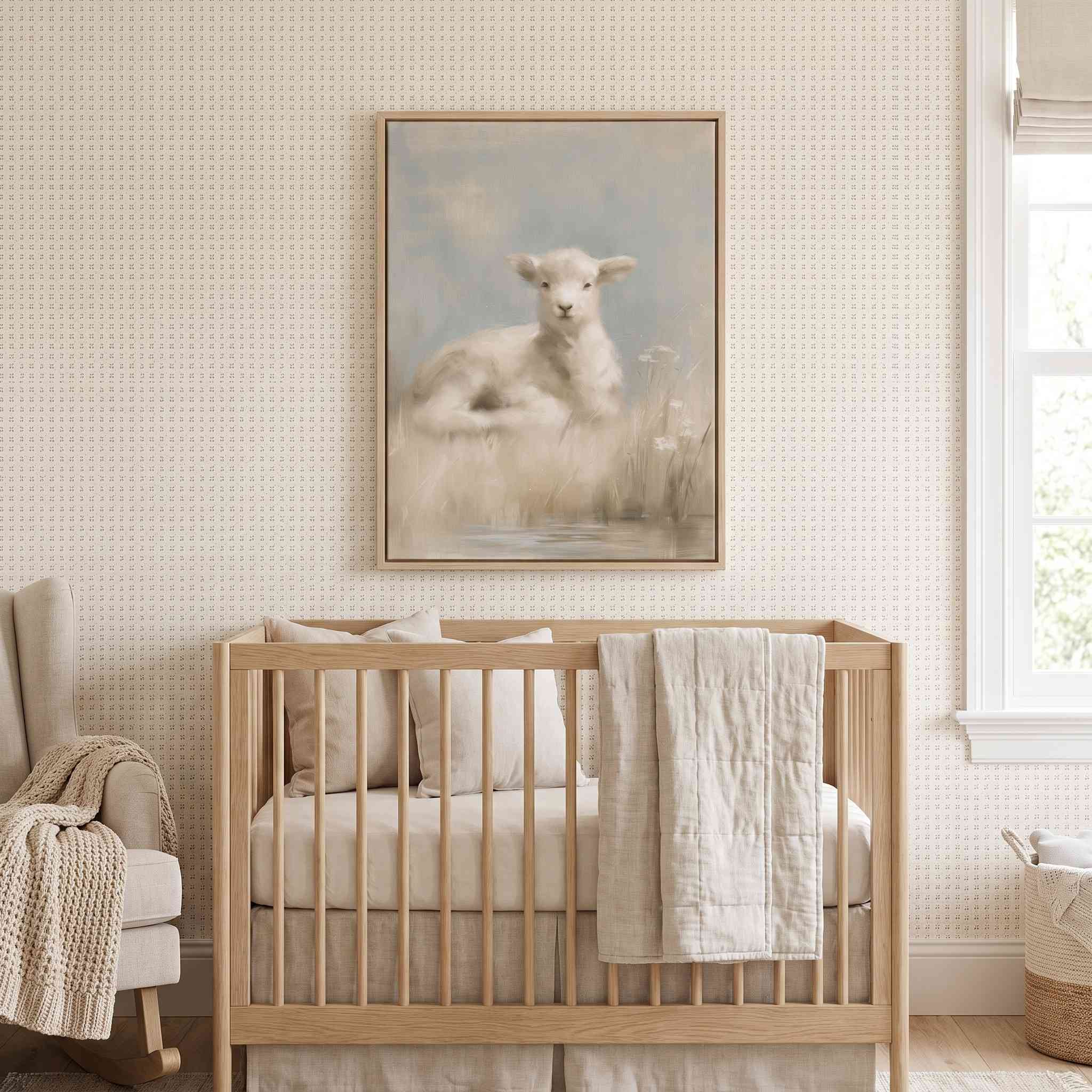 Rest by Still Waters Christian lamb framed canvas above a light wood crib in a cream nursery with textured wallpaper and a cushioned rocking chair.