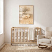 Framed Rest in Him sleeping lamb Christian nursery wall art above a wooden crib, with cream bedding and a rocking chair in a bright neutral baby room.