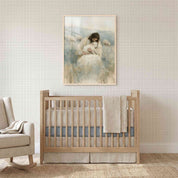 Rest in His Arms Jesus holding a lamb Christian nursery wall art in a light wood frame above a wooden crib beside a cream rocking chair.
