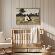 Framed vintage Christian wall art titled Rest in the Shepherd, depicting Jesus holding a lamb in a wildflower meadow, displayed above a light wood crib in a soft organic modern nursery.