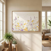 Horizontal Romans 15:13 "Abound in Hope" wildflower watercolor art in a light wood frame, styled on a neutral wall in a bright sunroom with wicker chairs and a potted fern.