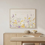 Horizontal Romans 15:13 "Abound in Hope" wildflower watercolor art in a light wood frame, styled on a neutral wall above a modern dining room sideboard and table.