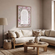 Framed Christian floral wall art titled Romans 5:3–5 featuring "Hope does not put us to shame" with watercolor botanical artwork, displayed on a light wall above a beige sectional sofa in a rustic modern living room.