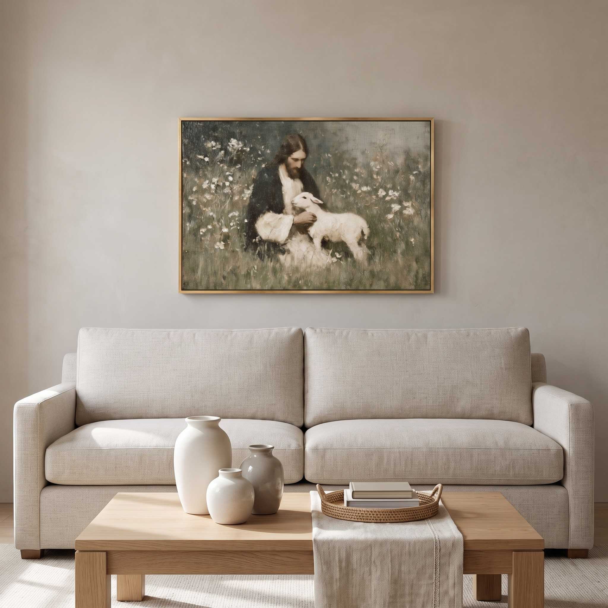 A framed vintage-style painting of a woman feeding a sheep hangs on a beige wall above a light gray sofa with decorative vases and a coffee table in a softly styled living room.