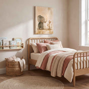 Show Love elephant and bunny Christian kids wall art on canvas above a wooden bed with blush bedding, children’s books and a woven basket.