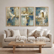 Contemporary Christian abstract 3-piece framed canvas wall art set featuring white dove, cross, and empty tomb motifs in blue, beige, and gold displayed on a light wall above a beige sofa in an organic modern living room.