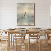 Framed Take Courage Jesus walking on water Christian wall art on a white paneled wall behind a wooden dining table with woven chairs and place settings.