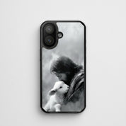 The Good Shepherd MagSafe® clear iPhone case featuring black and white watercolor artwork of Jesus embracing a lamb on a soft minimalist white background in an elegant Christian fine art style