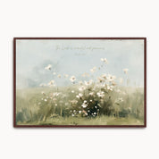 Vintage Psalm 103:8 landscape framed canvas wall art featuring soft white wildflowers in a sunlit meadow, handwritten scripture script, and an espresso wood frame.
