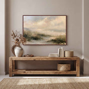 Framed vintage Psalm 27:1 Christian landscape canvas wall art featuring coastal dunes hanging above a rustic wooden console table with a ceramic vase, stacked books, and woven baskets in a warm entryway.