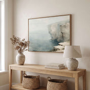 Framed vintage Psalm 18:2 Christian landscape canvas wall art featuring a coastal cliff scene hanging above a light wooden console table in a soft organic modern entryway.
