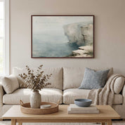 Framed vintage Psalm 18:2 Christian landscape canvas wall art featuring a coastal cliff scene hanging above a beige sofa and light wood coffee table in a coastal living room.