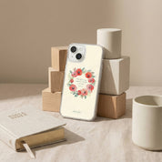 Phone case with floral design on a surface with books and cups