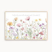Framed artwork with pink flowers and a scripture on a white background