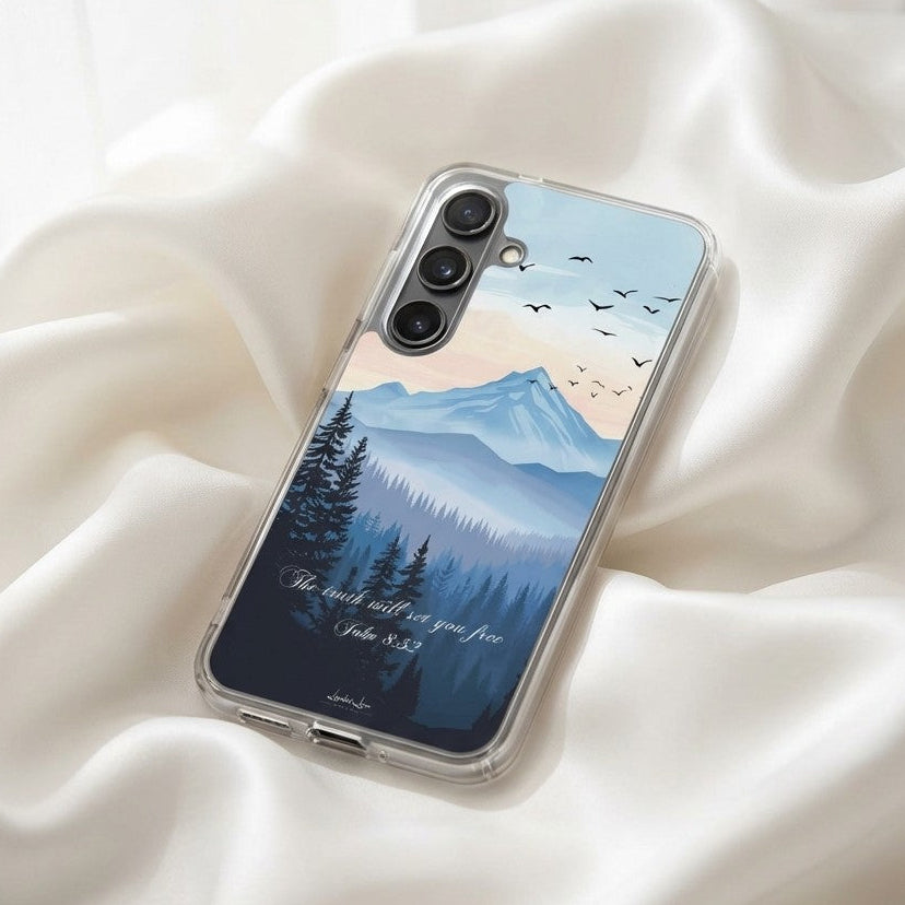Christian Samsung phone case with mountain and forest design on a white fabric background