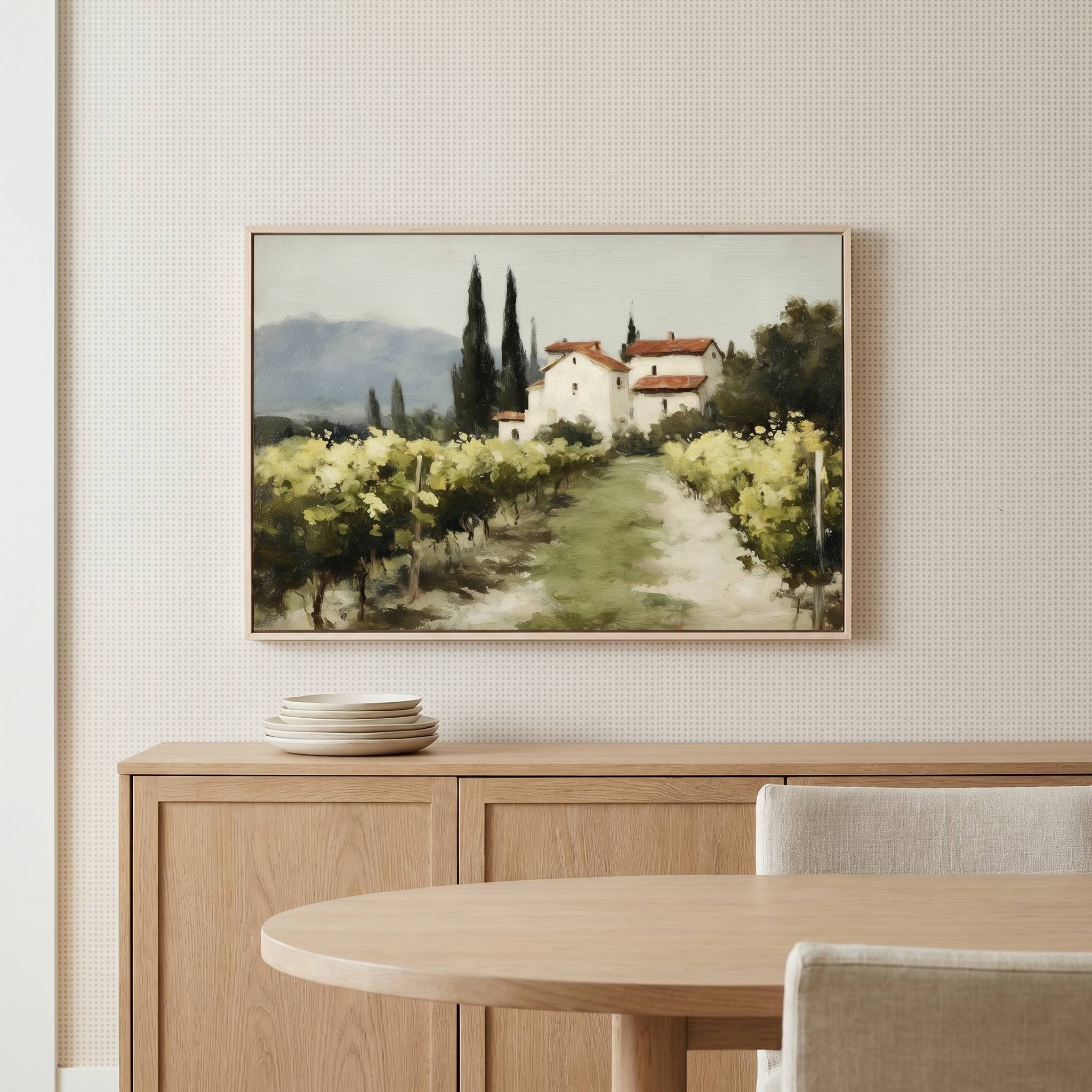 The Vineyard Christian landscape wall art displayed above a modern dining room sideboard, featuring a peaceful vineyard and countryside home that symbolizes abiding in Christ, spiritual growth, and God's faithful provision.
