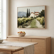 The Vineyard Christian landscape wall art displayed above a modern fireplace mantel, featuring a peaceful vineyard and countryside home that symbolizes abiding in Christ, spiritual growth, and God's faithful provision.
