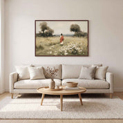Framed vintage Christian wall art titled Walking with Jesus, featuring Jesus walking through a wildflower meadow, displayed in a soft organic modern living room above a beige sofa.