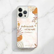 Phone case with floral design and text on a marble background