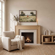Framed vintage Christian wall art titled Walking with Jesus, featuring Jesus walking through a wildflower meadow, displayed above a light wood fireplace mantel in a soft organic modern living room.