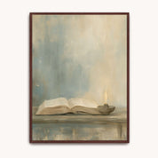 Psalm 119:105 Christian wall art with an open Bible and glowing oil lamp on a table against a muted blue and cream background, in a dark wood frame.